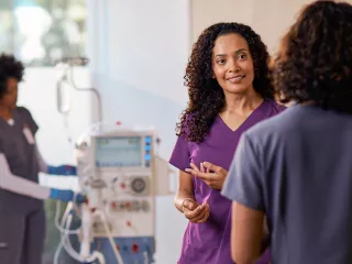 Healthcare professionals talking in healthcare setting